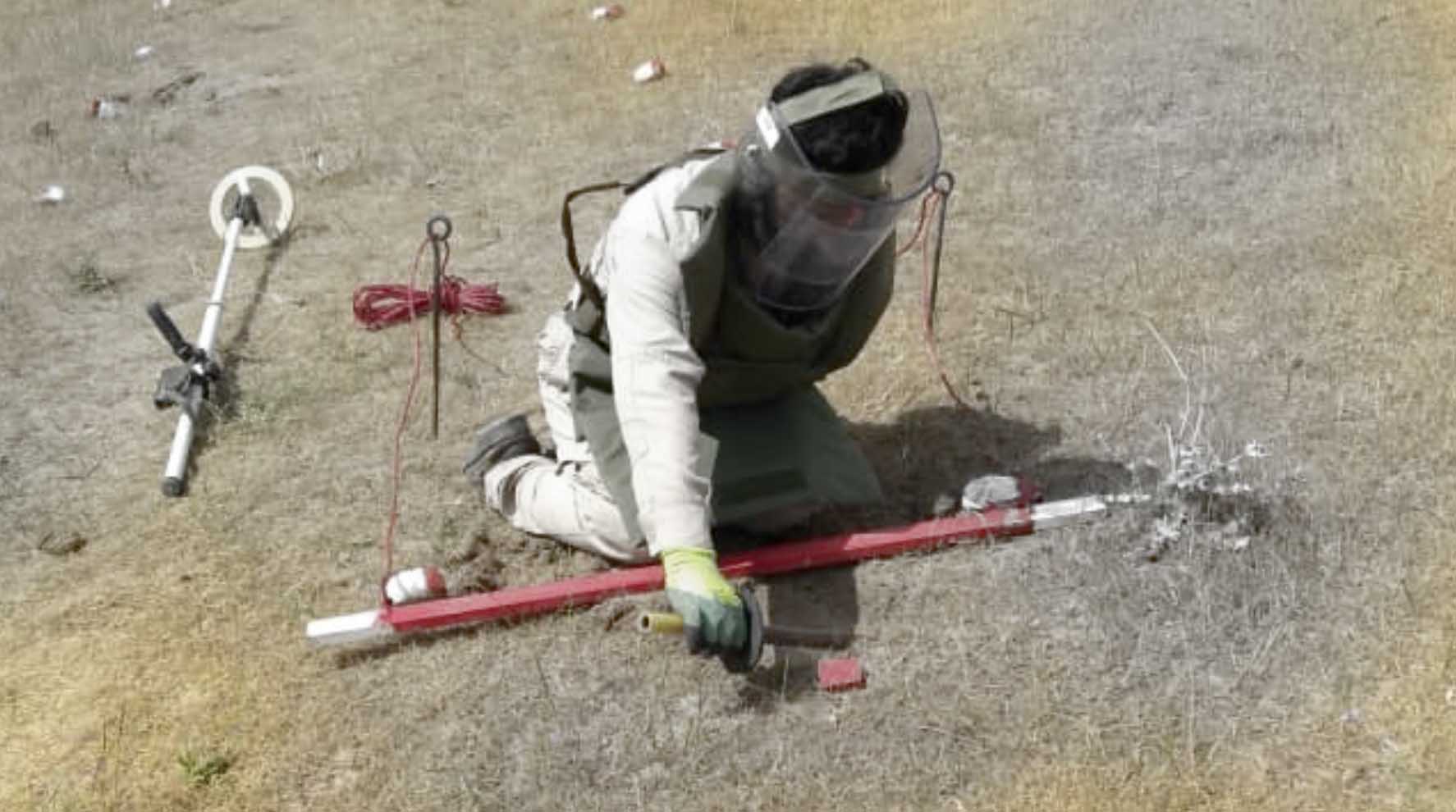 Mine clearance specialist working in the field